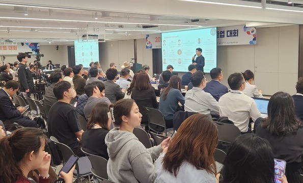 The representative of Bridge AI Pty Ltd, participating in the competition, is giving a pitch.